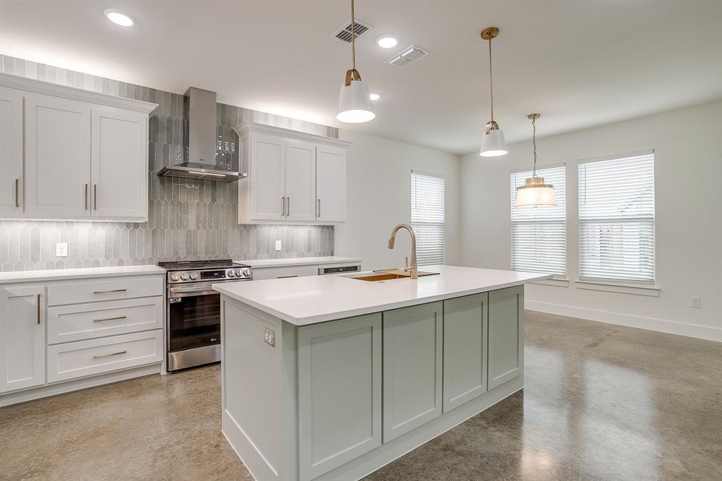106 Cardinal Wds Granbury, TX 76049 - Photo 8 of 22 a kitchen that has a sink a stove and cabinets