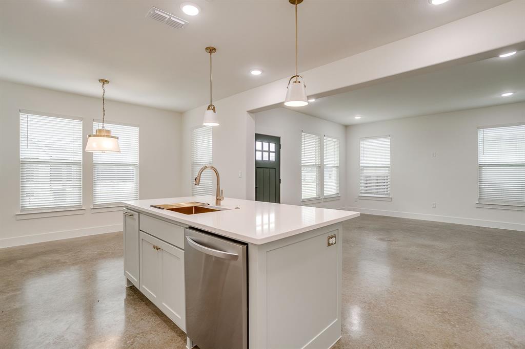 106 Cardinal Wds Granbury, TX 76049 - Photo 10 of 22 a kitchen that has a sink a stove and a window