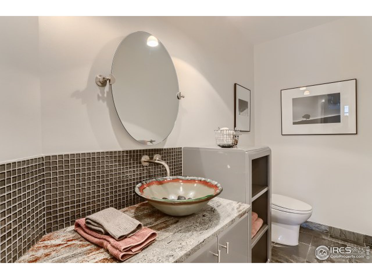 1360 Walnut Street, Unit 301 Boulder, CO 80302 - Photo 14 of 40 a bathroom with a sink a toilet and mirror