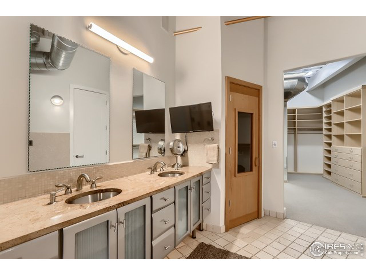 1360 Walnut Street, Unit 301 Boulder, CO 80302 - Photo 19 of 40 a bathroom with a sink and a mirror