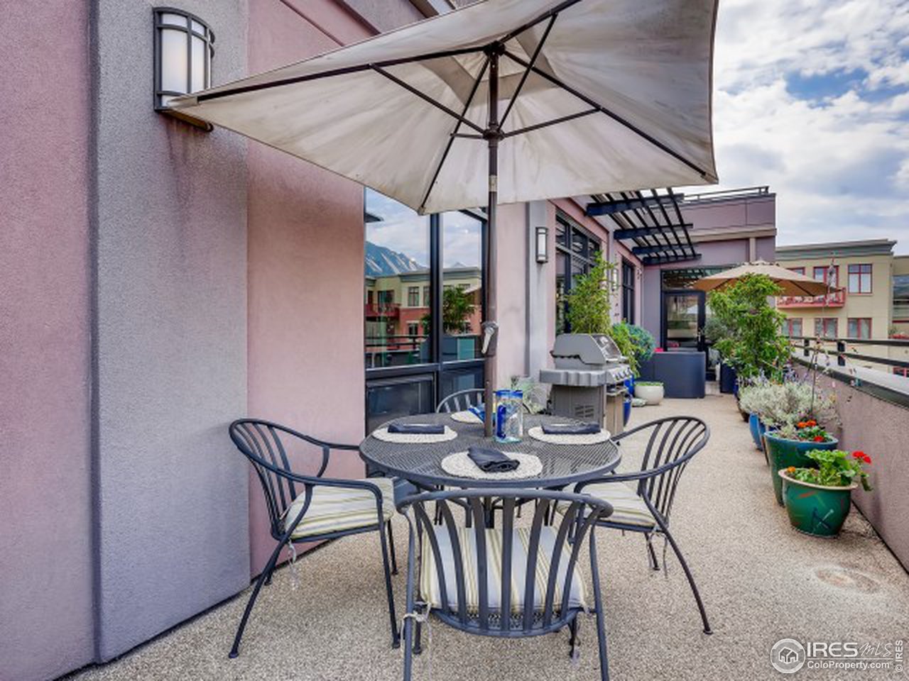 1360 Walnut Street, Unit 301 Boulder, CO 80302 - Photo 31 of 40 a view of a patio with a table and chairs