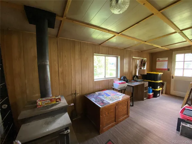 a living room with furniture and a pool table