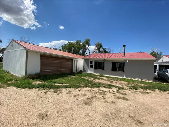 a view of a livingroom with furniture and a window