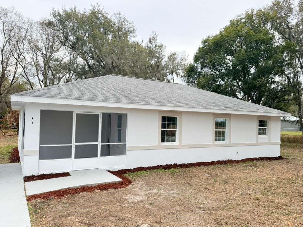 33 Sand Mountain Road Fort Meade, FL 33841 - Photo 1 of 9 a house with trees in the background