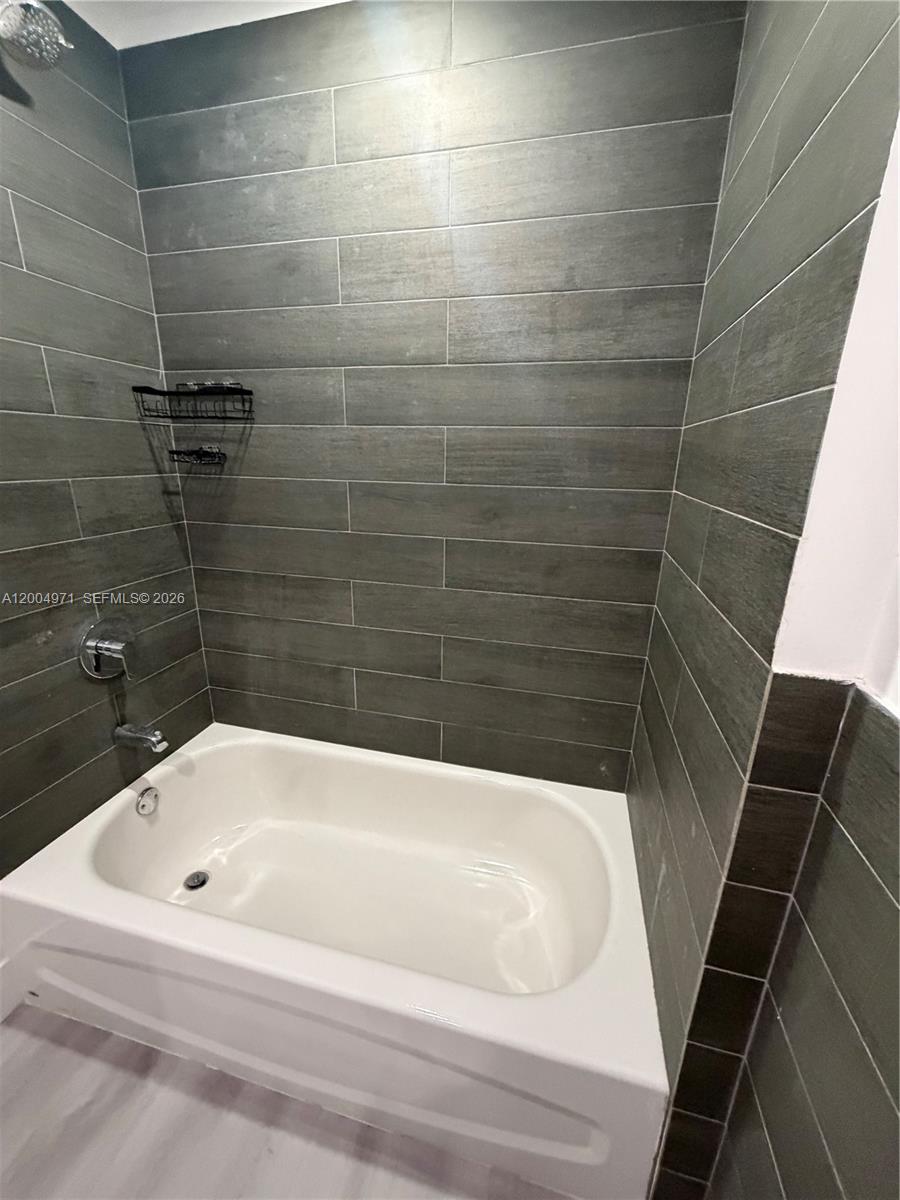 853 East 24th Street, Unit 203 Hialeah, FL 33013 - Photo 11 of 13 a bathroom with a bathtub