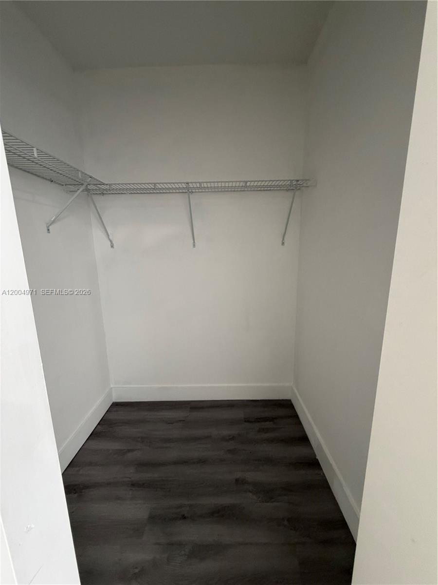 853 East 24th Street, Unit 203 Hialeah, FL 33013 - Photo 13 of 13 a view of a room with wooden floor