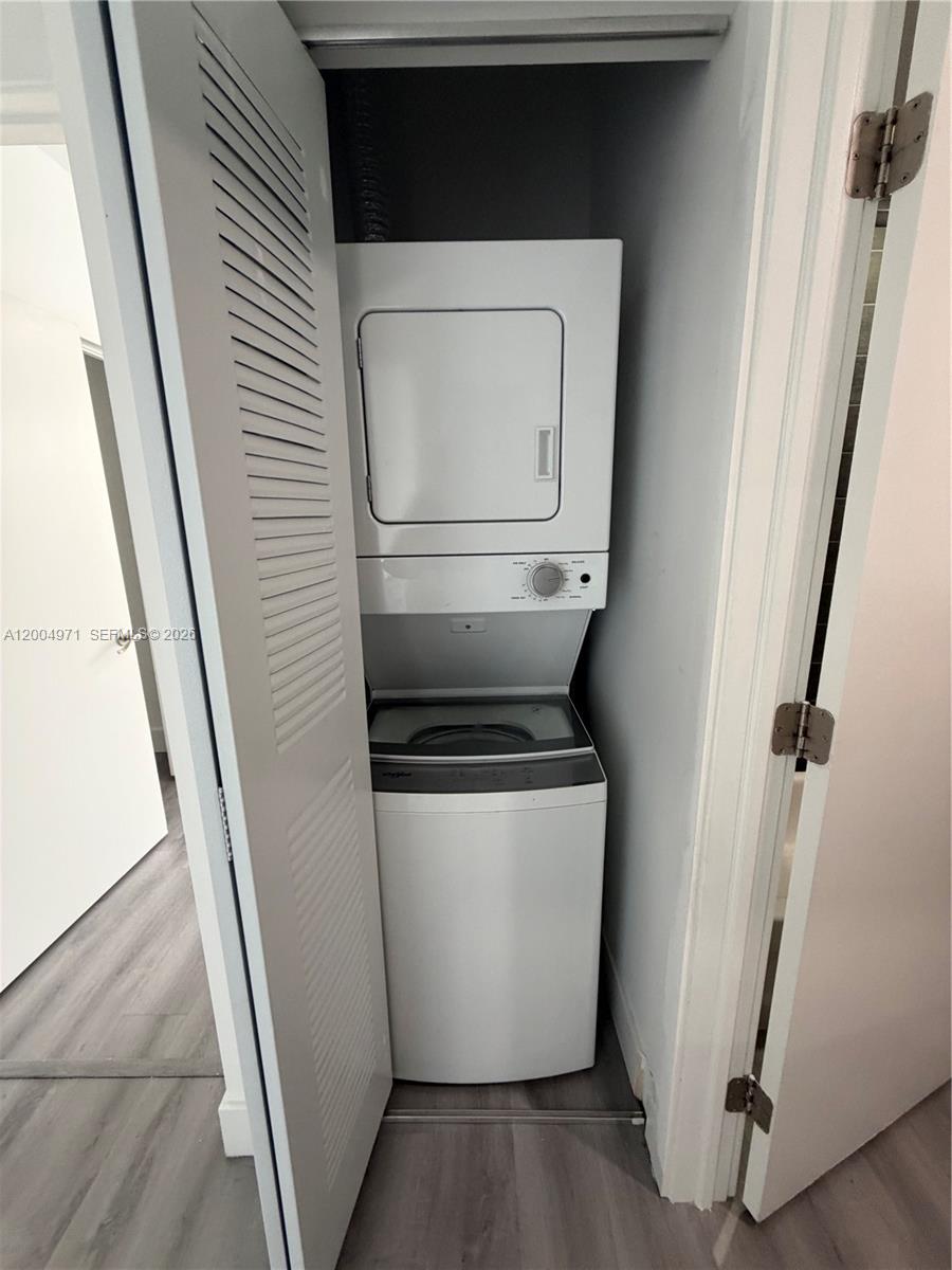 853 East 24th Street, Unit 203 Hialeah, FL 33013 - Photo 9 of 13 a utility room with dryer and washer