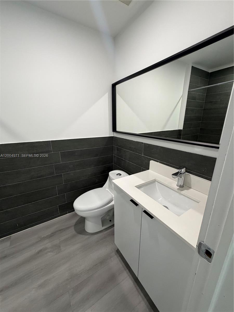 853 East 24th Street, Unit 203 Hialeah, FL 33013 - Photo 10 of 13 a bathroom with a sink and a toilet