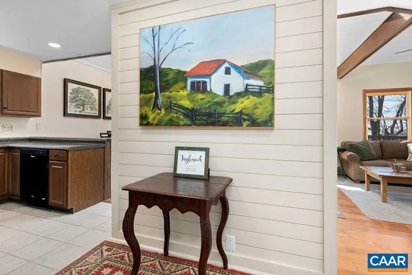 a kitchen with stainless steel appliances granite countertop a stove microwave and sink