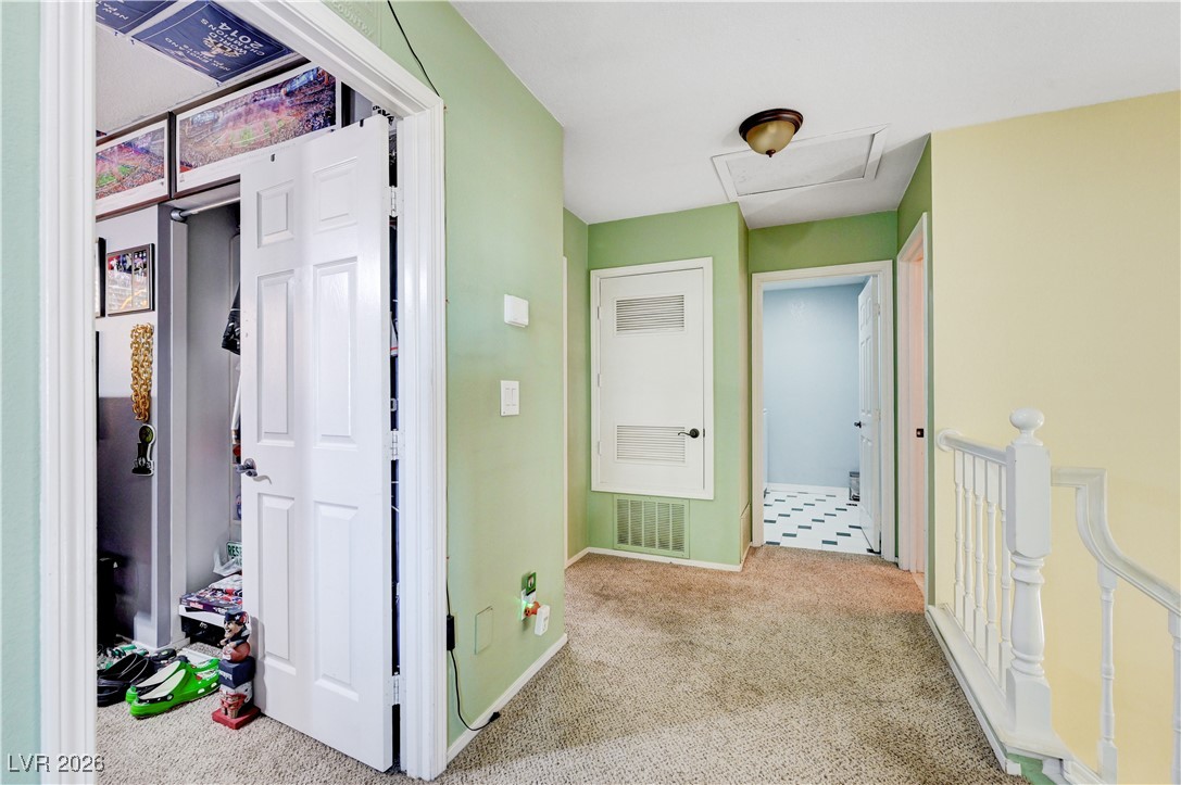 14 Barton Spring Circle Henderson, NV 89074 - Photo 27 of 64 Corridor featuring carpet flooring and an upstairs landing