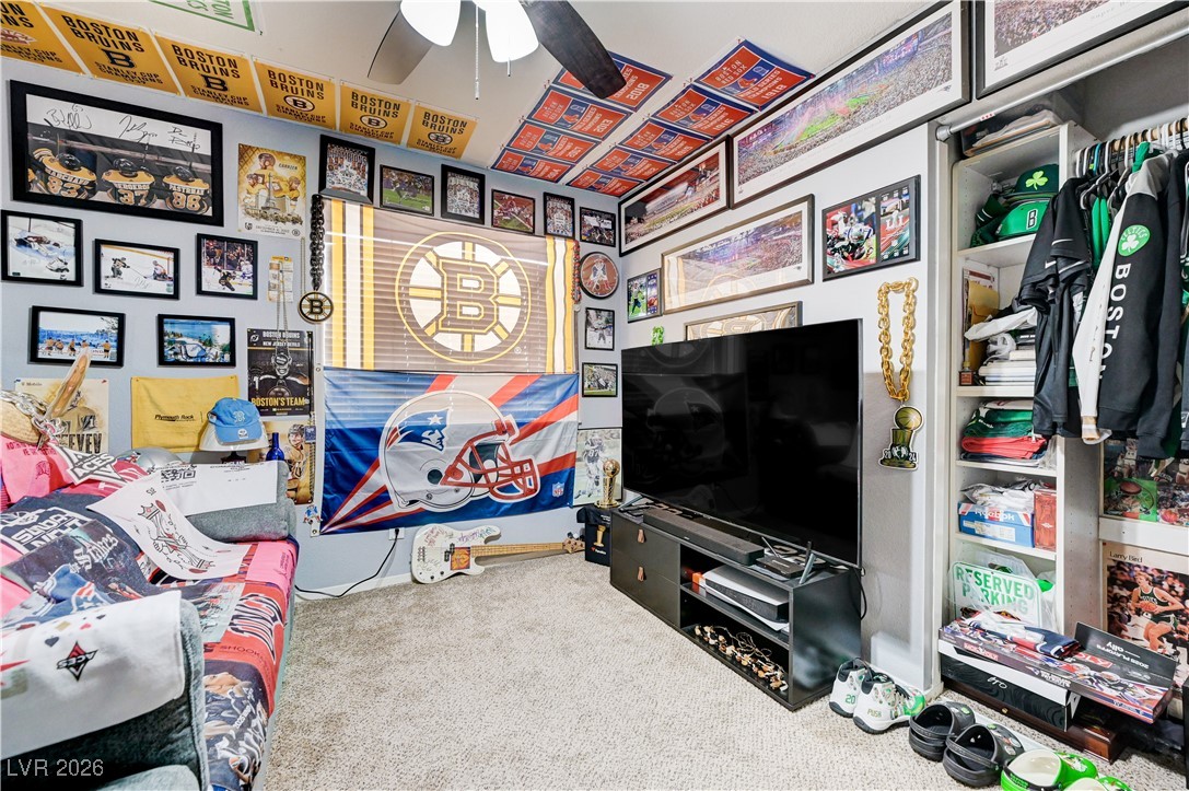 14 Barton Spring Circle Henderson, NV 89074 - Photo 38 of 64 Recreation room featuring carpet flooring and a ceiling fan