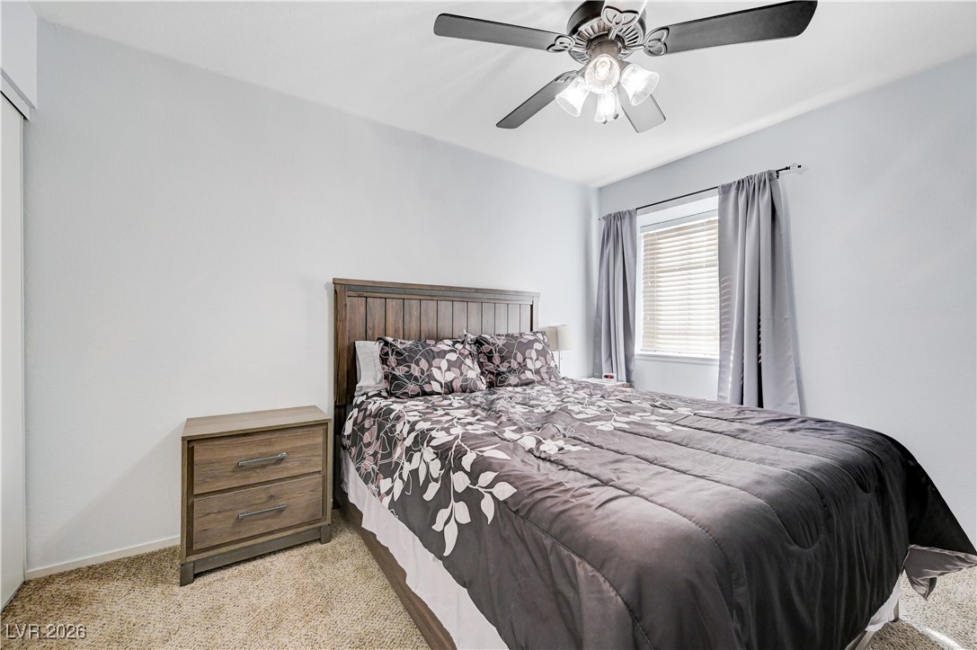 14 Barton Spring Circle Henderson, NV 89074 - Photo 39 of 64 Bedroom featuring light carpet and ceiling fan