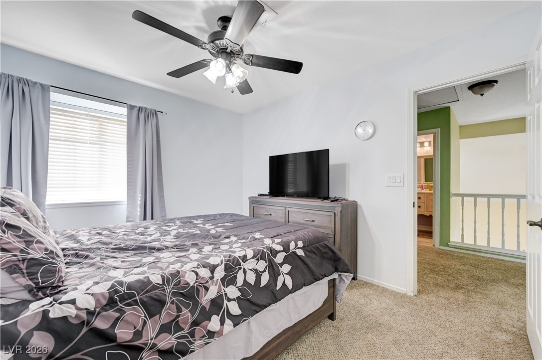 14 Barton Spring Circle Henderson, NV 89074 - Photo 40 of 64 Carpeted bedroom featuring ceiling fan and baseboards