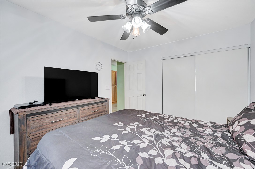 14 Barton Spring Circle Henderson, NV 89074 - Photo 41 of 64 Bedroom featuring ceiling fan and a closet