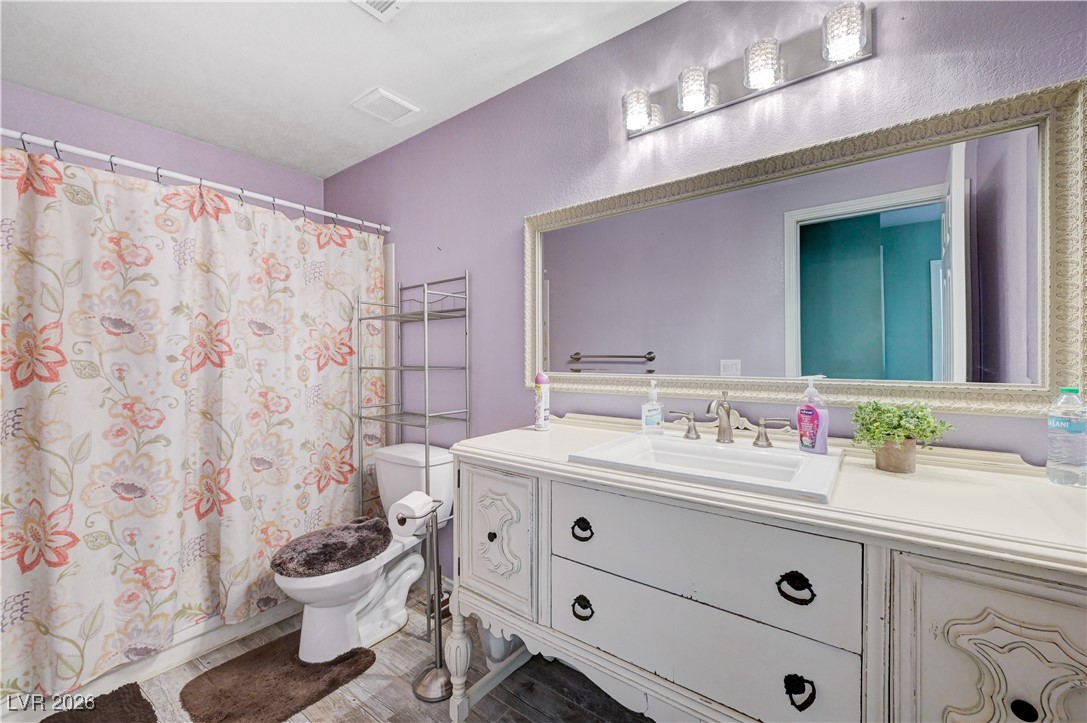14 Barton Spring Circle Henderson, NV 89074 - Photo 42 of 64 Full bath featuring vanity and toilet