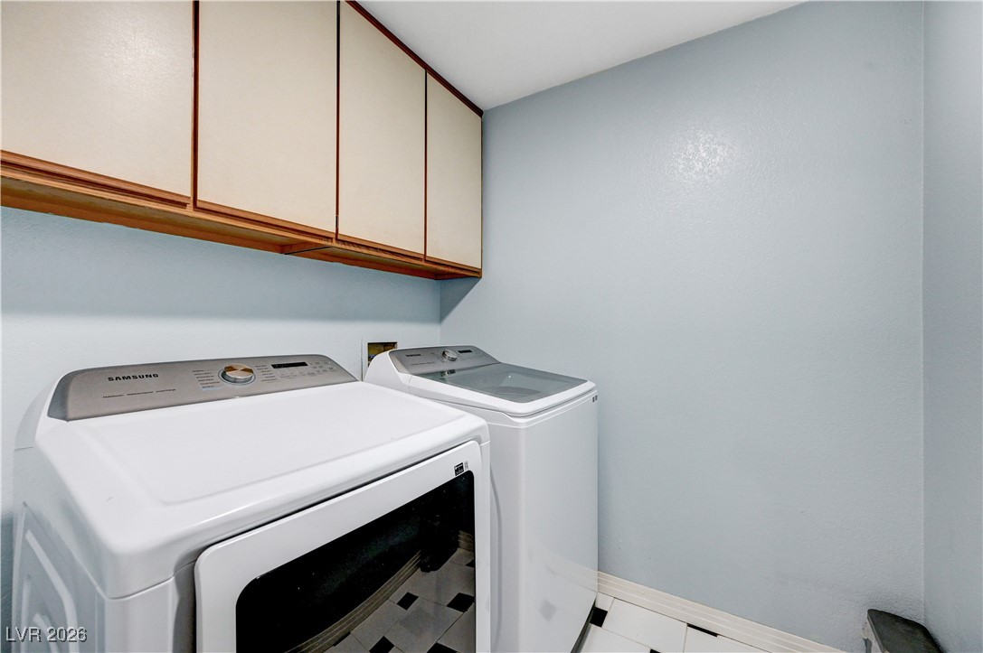 14 Barton Spring Circle Henderson, NV 89074 - Photo 43 of 64 Washroom with cabinet space and washing machine and clothes dryer