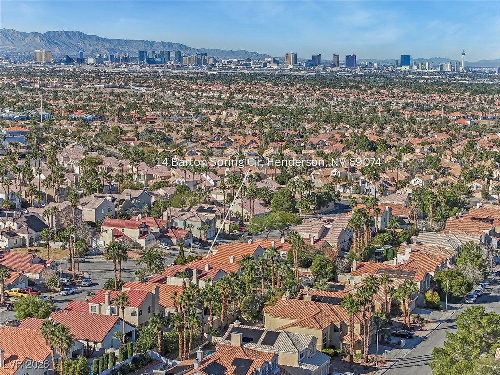 14 Barton Spring Circle Henderson, NV 89074 - Photo 57 of 64 Aerial view of city skyline and a mountainous background
