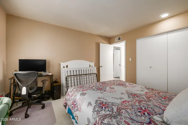 a bedroom with a bed and furniture