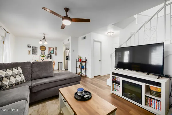 a living room with furniture and a flat screen tv