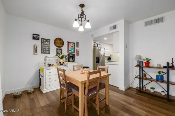 a view of a dining room with furniture and wooden floor