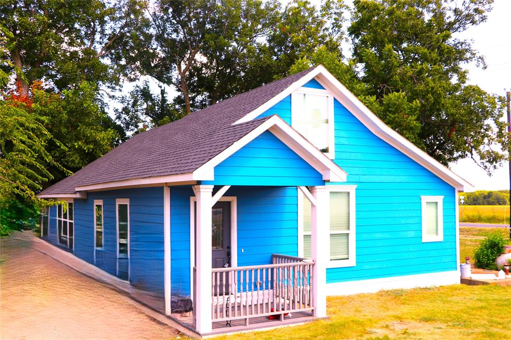 6164 Highway 289 Howe, TX 75459 - Photo 1 of 21 a view of a house with a yard balcony and wooden fence