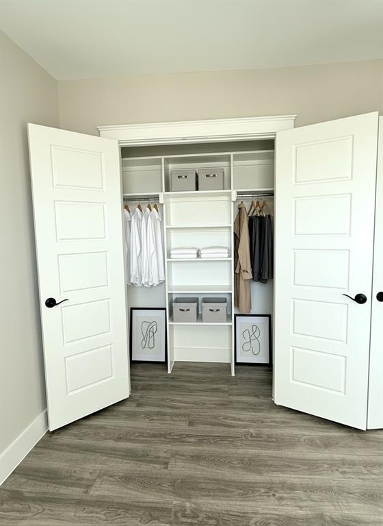 6164 Highway 289 Howe, TX 75459 - Photo 14 of 21 a view of walk in closet with empty racks