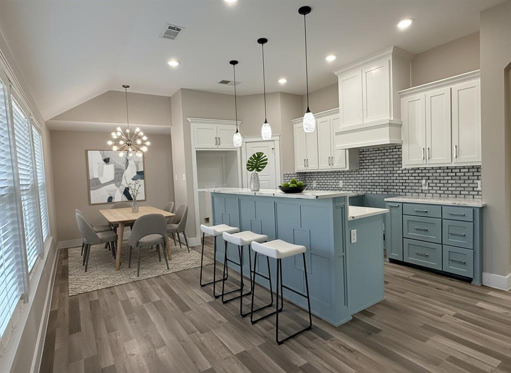 6164 Highway 289 Howe, TX 75459 - Photo 3 of 21 a kitchen with a table chairs sink and cabinets