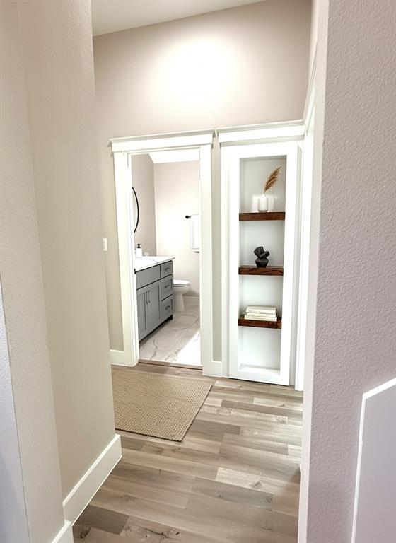 6164 Highway 289 Howe, TX 75459 - Photo 5 of 21 a view of a hallway with wooden floor and cabinet