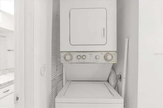 a view of an empty room and closet area