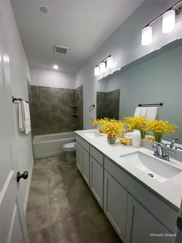 a bedroom with a bed and glass window