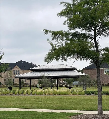a view of a swimming pool with lawn chairs