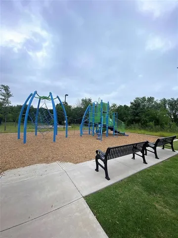 a view of a swimming pool with a yard