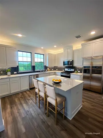 a view of entryway with wooden floor