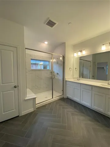 a view of a bathroom with tub shower and a sink