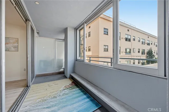 a view of an entryway with wooden floor