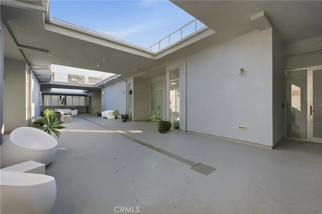 a view of living room with furniture and a large window