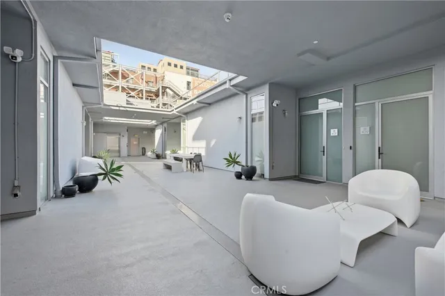 a view of parking garage with cars