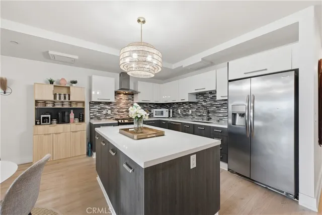 a kitchen with stainless steel appliances a counter top space cabinets and stainless steel appliances