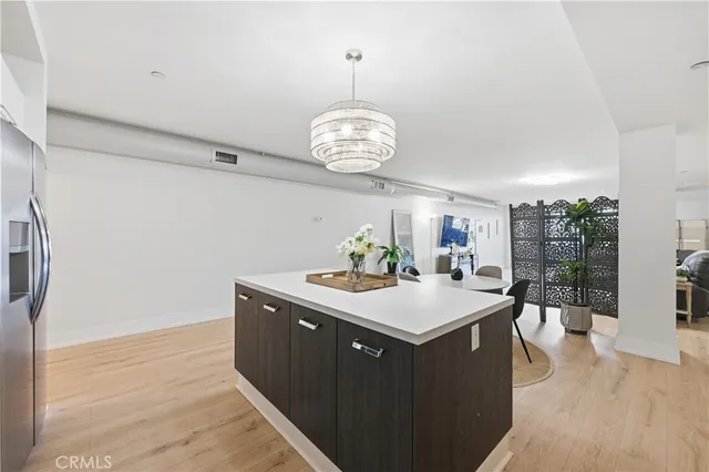 a kitchen with a sink and a refrigerator