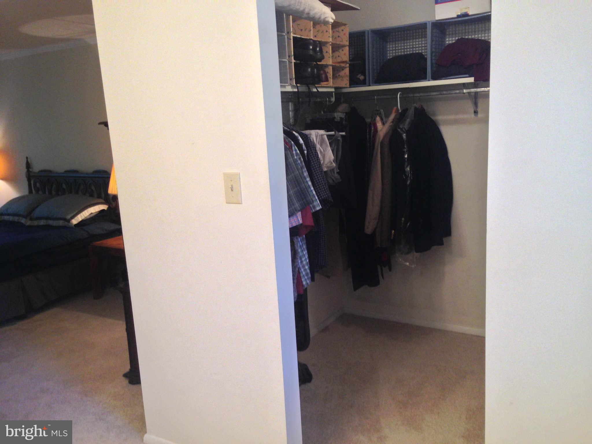 8066 Athena Street Springfield, VA 22153 - Photo 19 of 30 a view of walk in closet with clothes and shoes