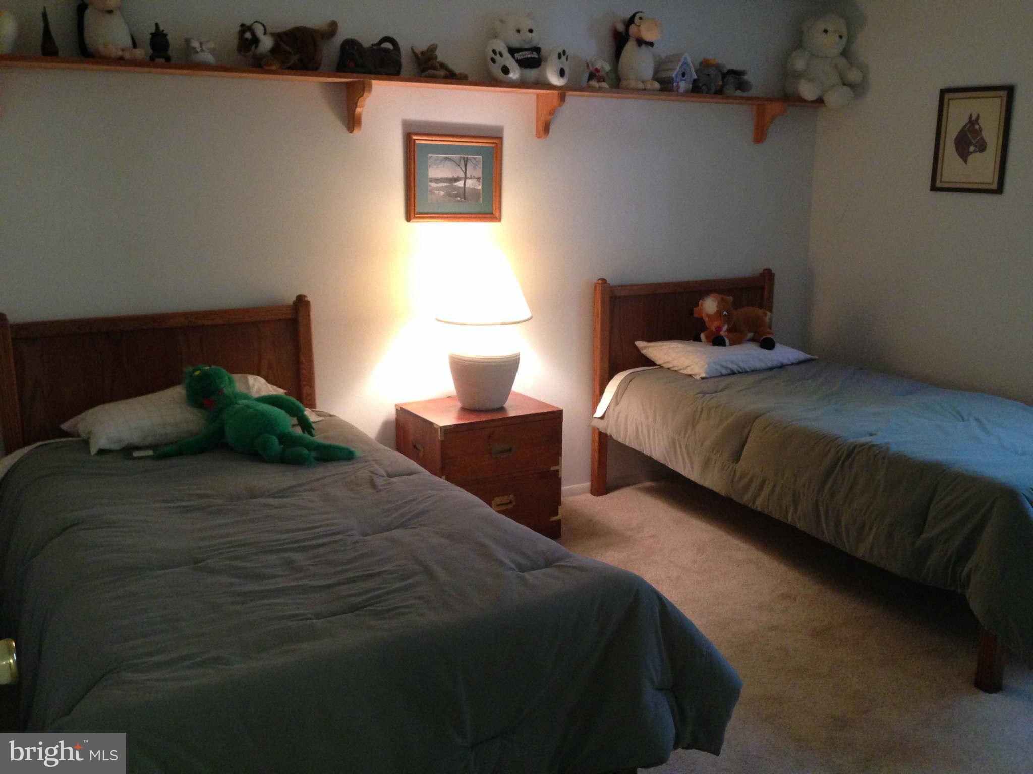 8066 Athena Street Springfield, VA 22153 - Photo 22 of 30 a bedroom with bed and window