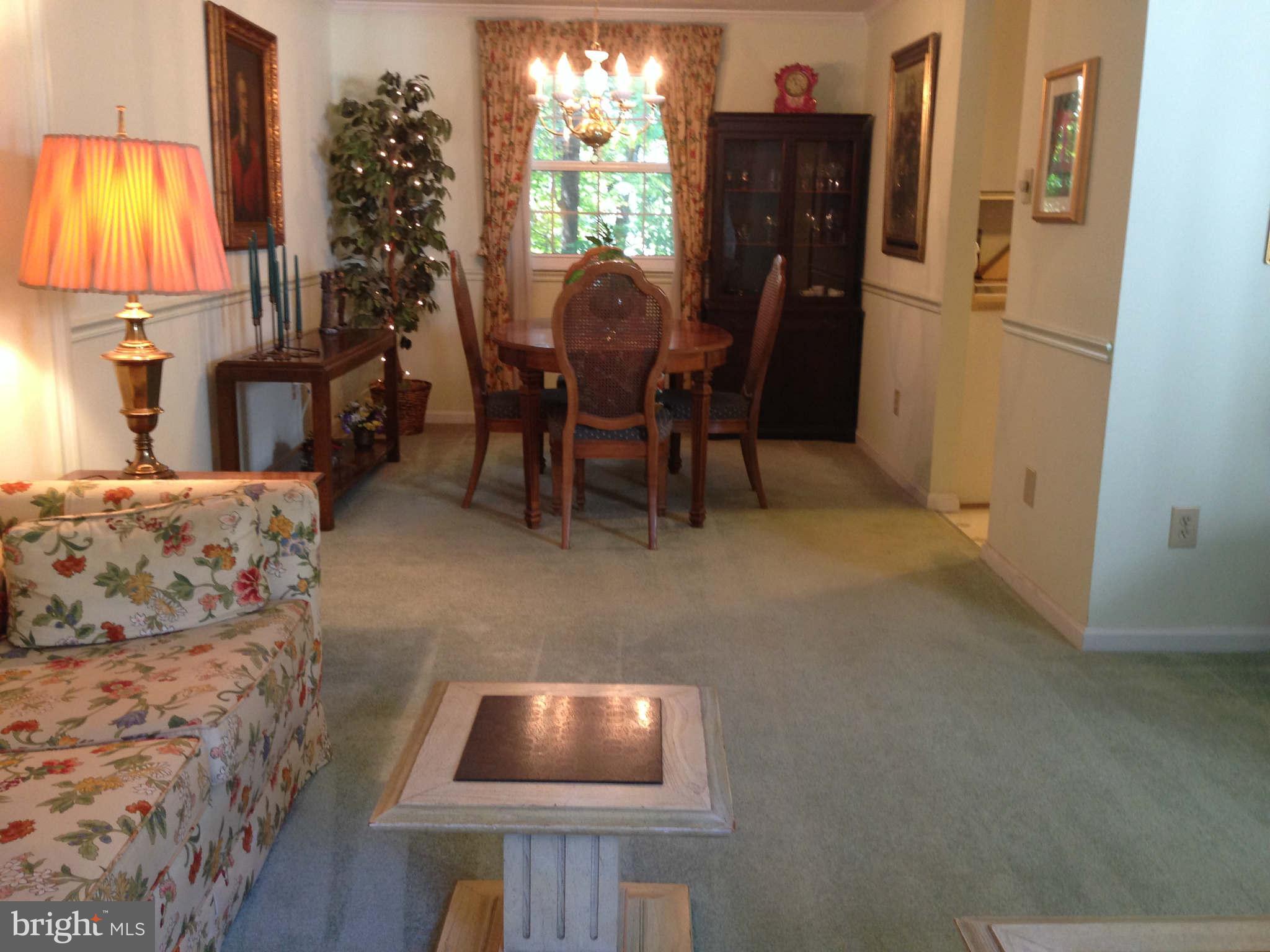 8066 Athena Street Springfield, VA 22153 - Photo 5 of 30 a living room with furniture and a window