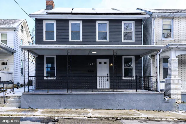 a view of entrance gate of a house