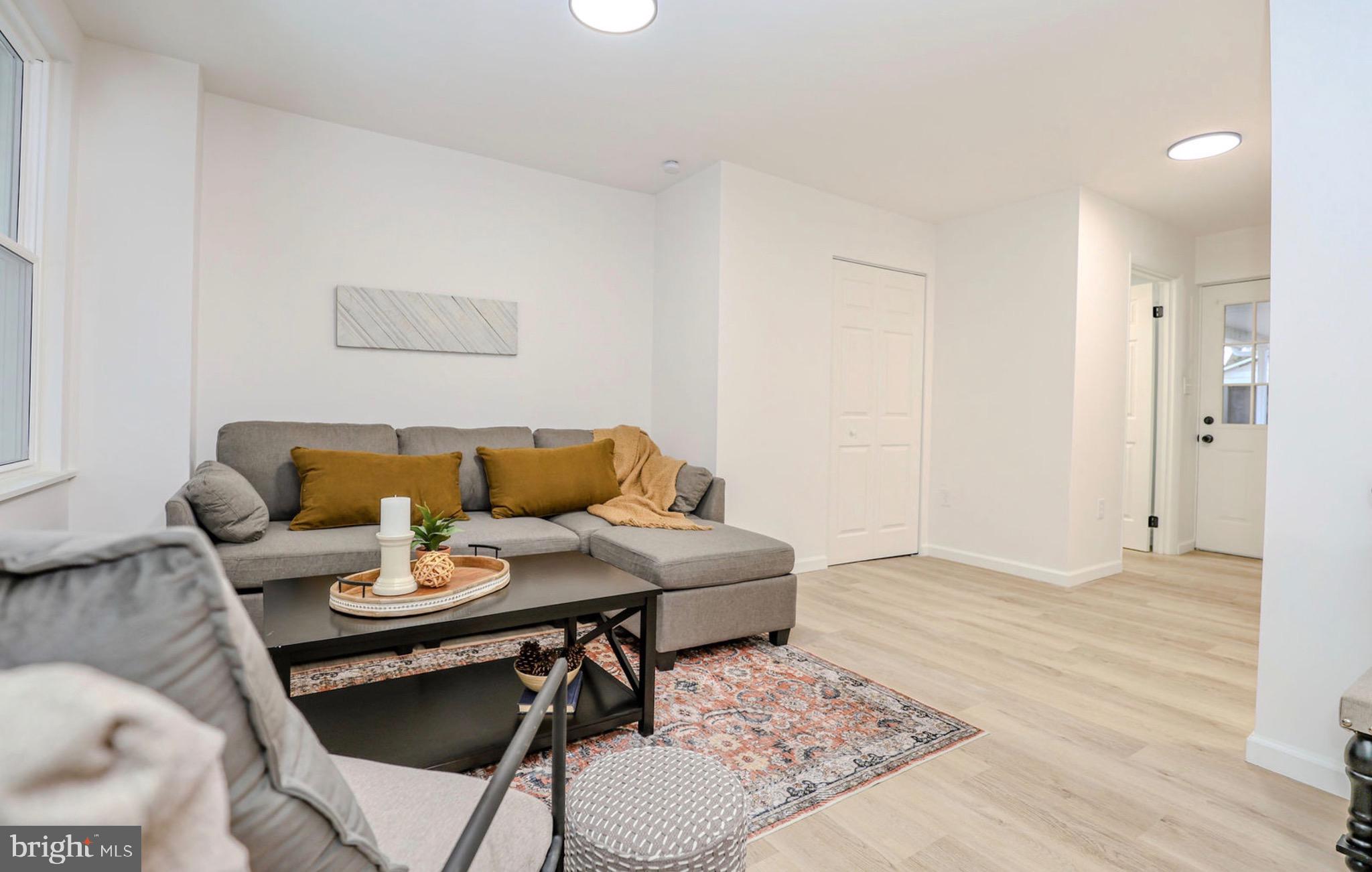 1234 Main Street Harrisburg, PA 17113 - Photo 7 of 36 a living room with furniture and wooden floor