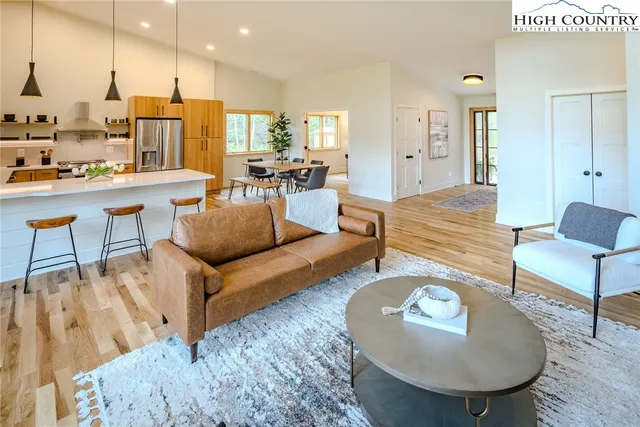 a spacious bedroom with a bed and a large window