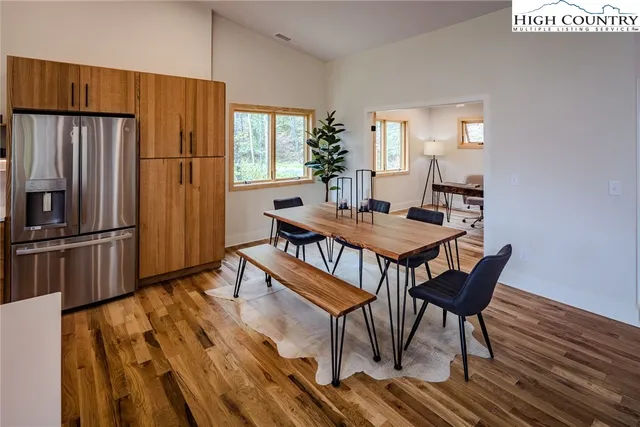 a view of a balcony with lake view and a potted plant