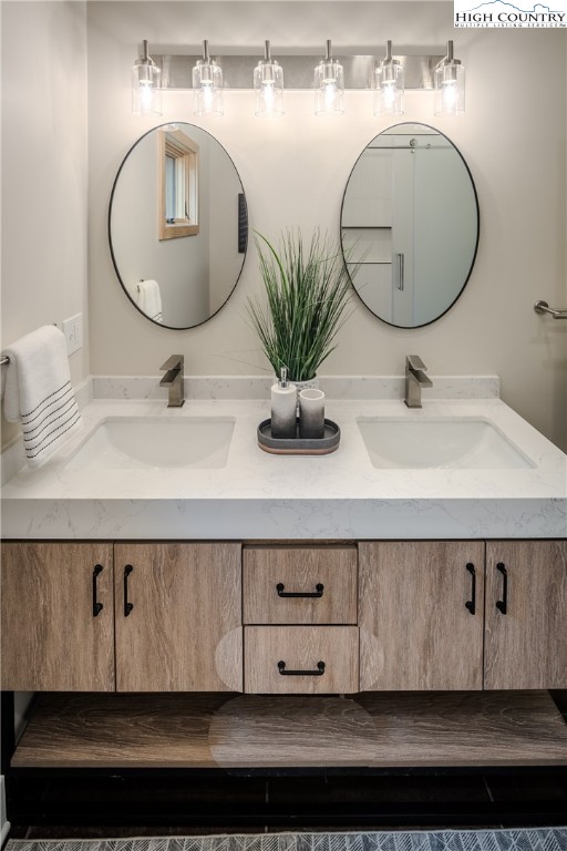 281 New Riv Farms Road Fleetwood, NC 28626 - Photo 28 of 50 a bathroom with a sink a mirror and vanity