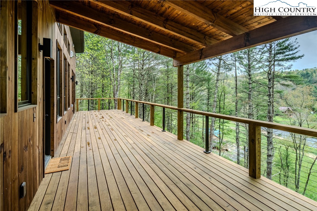 281 New Riv Farms Road Fleetwood, NC 28626 - Photo 36 of 50 a view of a balcony with wooden floor