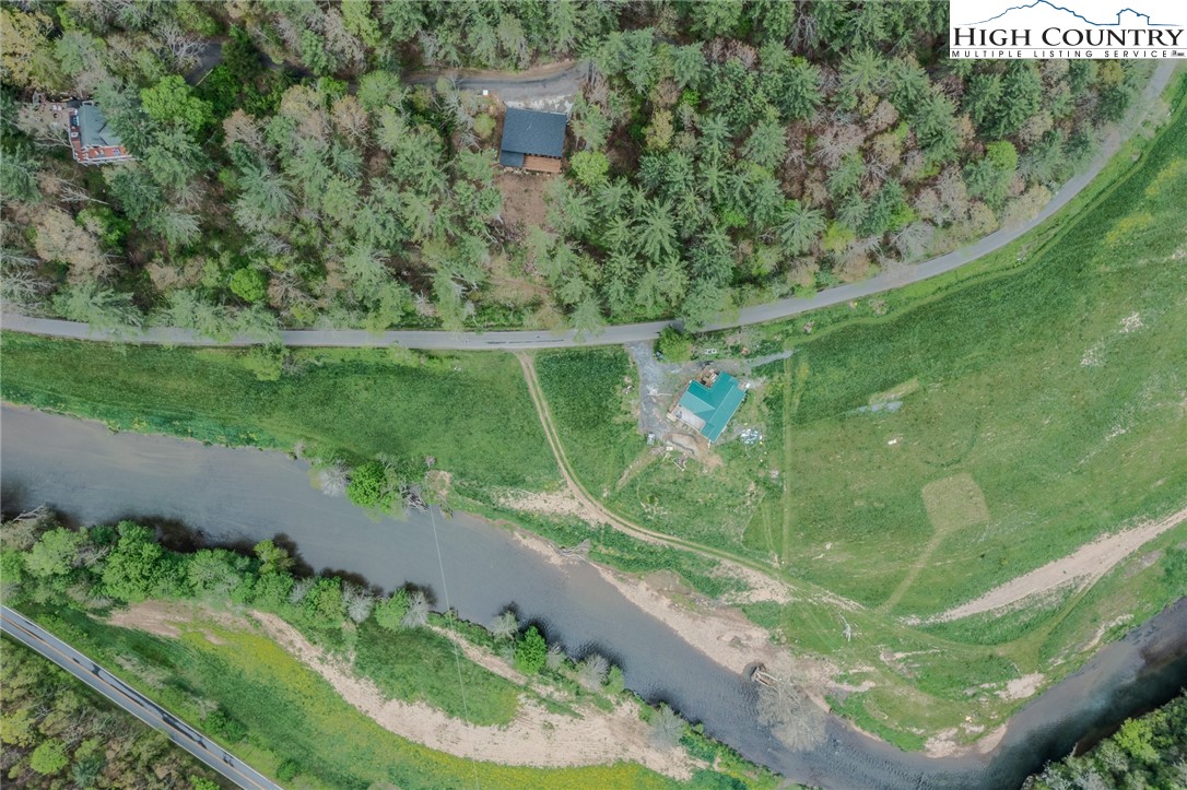 281 New Riv Farms Road Fleetwood, NC 28626 - Photo 47 of 50 a view of a lake from a balcony