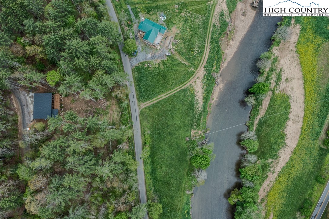 281 New Riv Farms Road Fleetwood, NC 28626 - Photo 49 of 50 an aerial view of a house